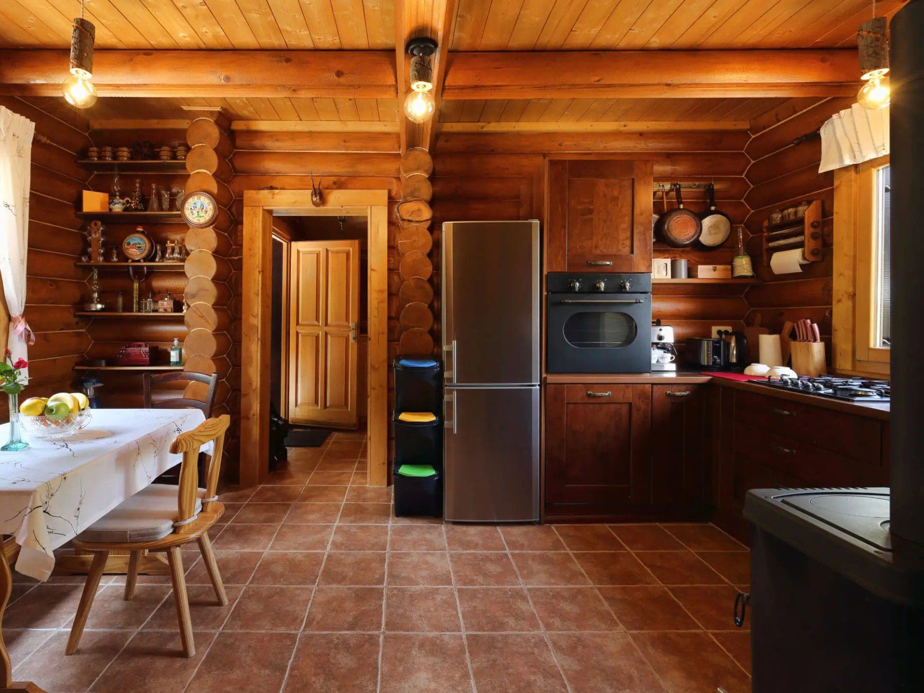 Cozy wooden kitchen with dining area.